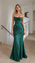 Front view of model wearing emerald green strapless ruched mermaid evening dress