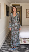 Front view of model wearing blue floral maxi dress