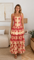 Front view of apricot and red printed square neck tiered maxi dress