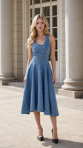 Front view of model wearing blue sleeveless floral applique midi dress