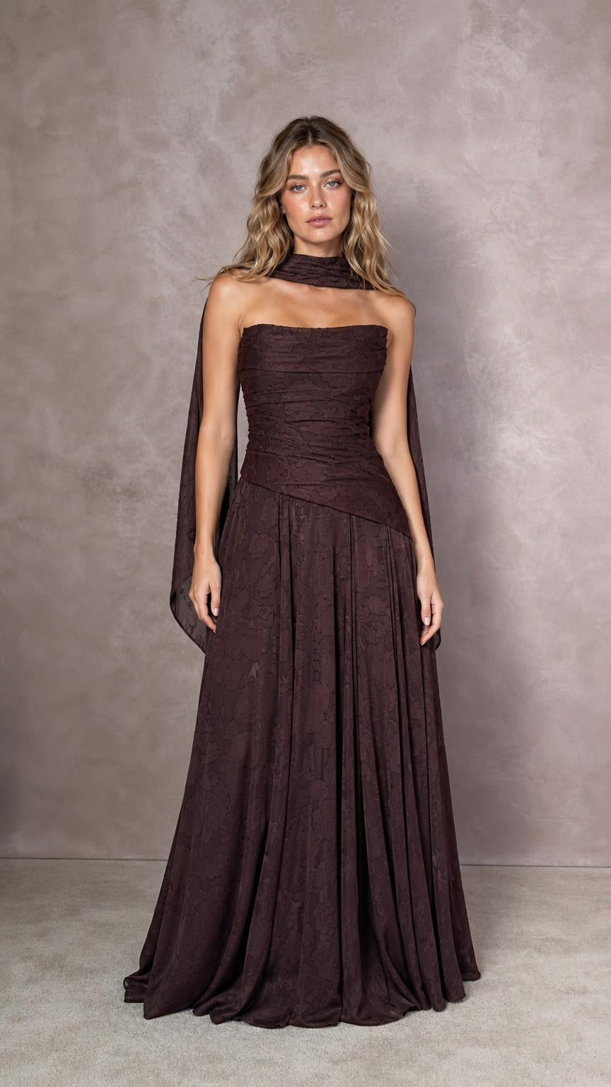 Front view of model wearing espresso brown strapless evening dress with matching scarf