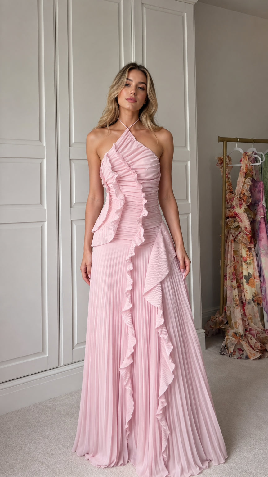 Front view of model wearing pink halter neck pleated ruffle maxi dress