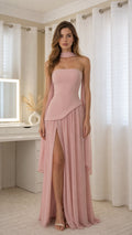 Front view of model wearing pink choker maxi dress with high slit