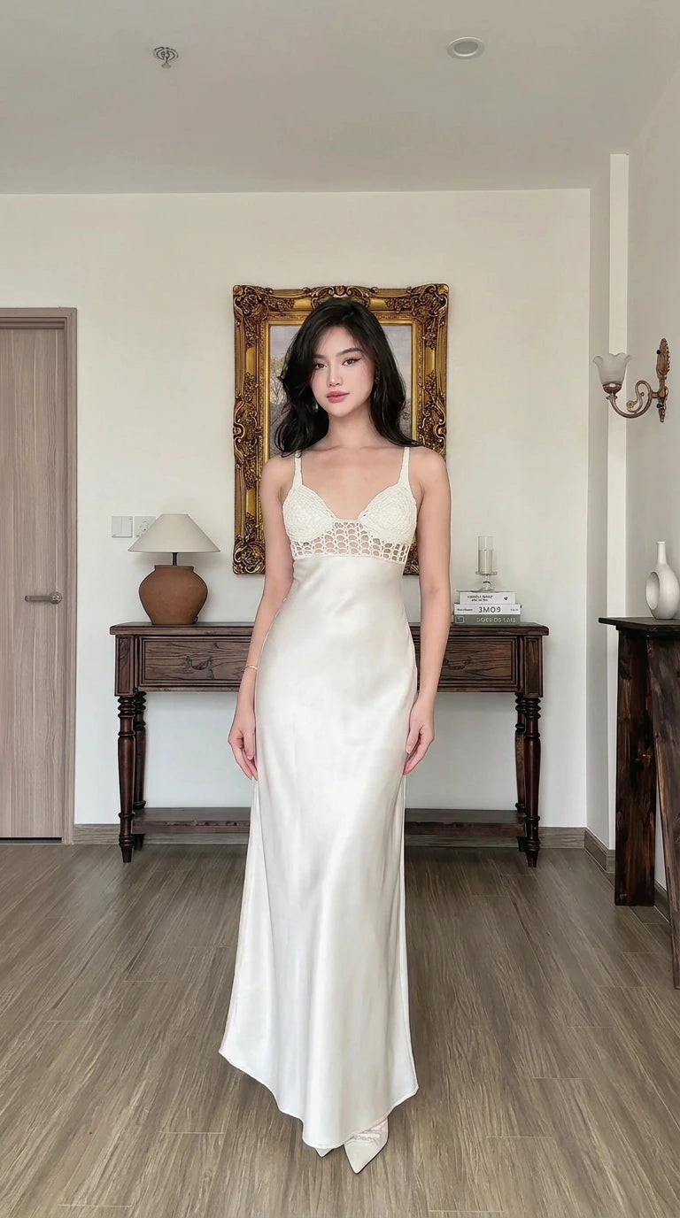 Front view of woman wearing white satin maxi slip dress with crochet contrast