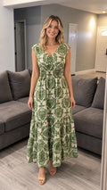 Front view of green damask print maxi dress on model
