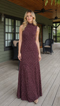 Front view of woman wearing burgundy textured mock neck sleeveless maxi dress