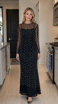 Front view of model wearing black pearl embellished mesh maxi dress