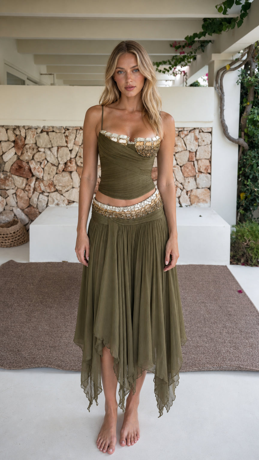 Front view of model wearing olive green beaded two-piece crop top and asymmetric skirt set