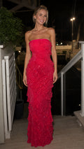 Front view of model wearing hot pink strapless sequined ruffle maxi evening dress