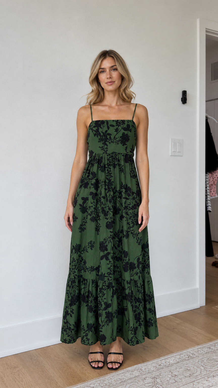 Front view of model wearing green floral maxi dress