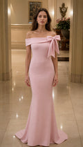 Front view of light pink off-shoulder mermaid evening gown with shoulder bow