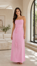 Front view of pink strapless maxi dress with tonal appliqué detailing and rope tie waist
