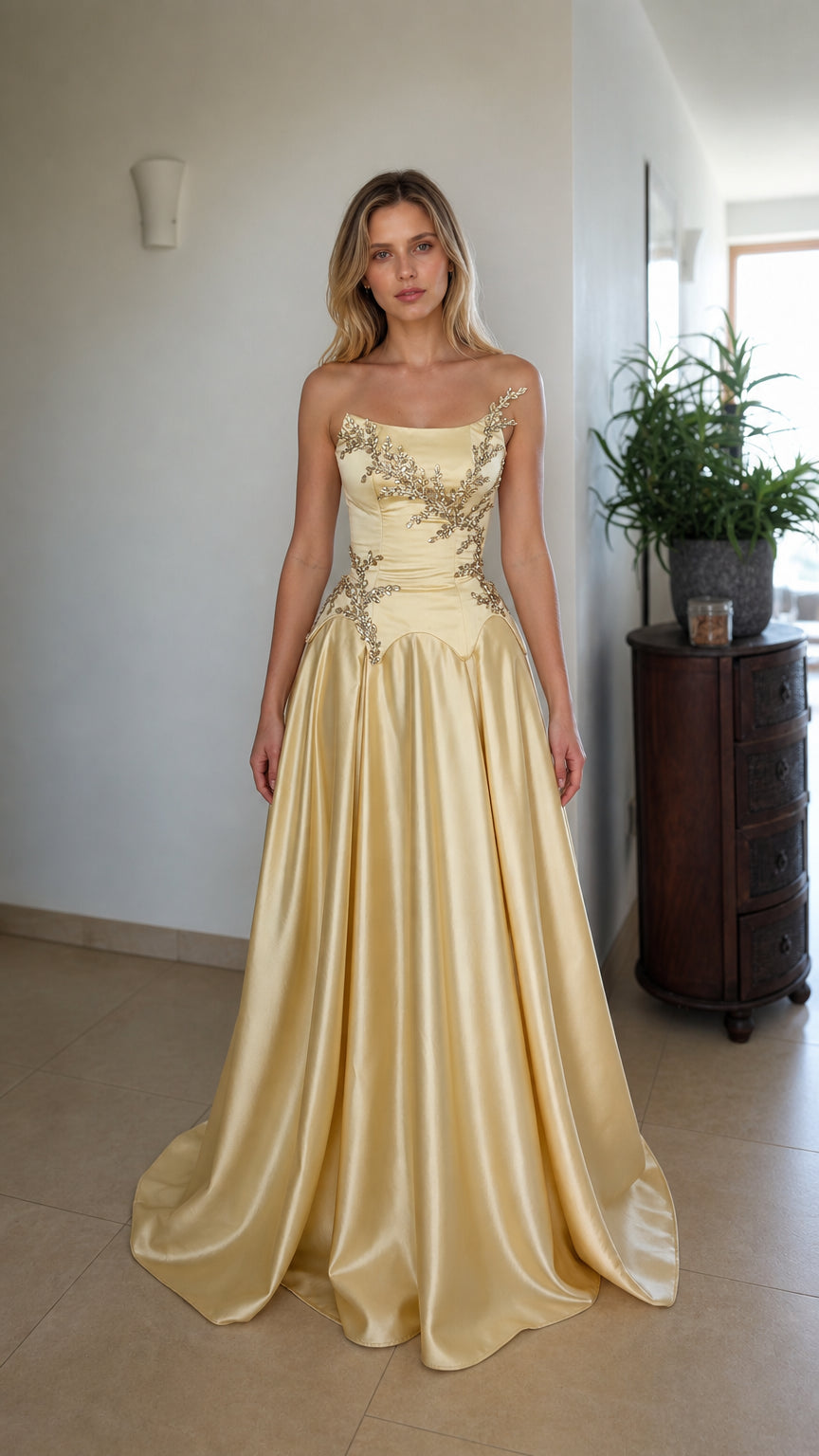 Front view of champagne strapless beaded corset evening dress