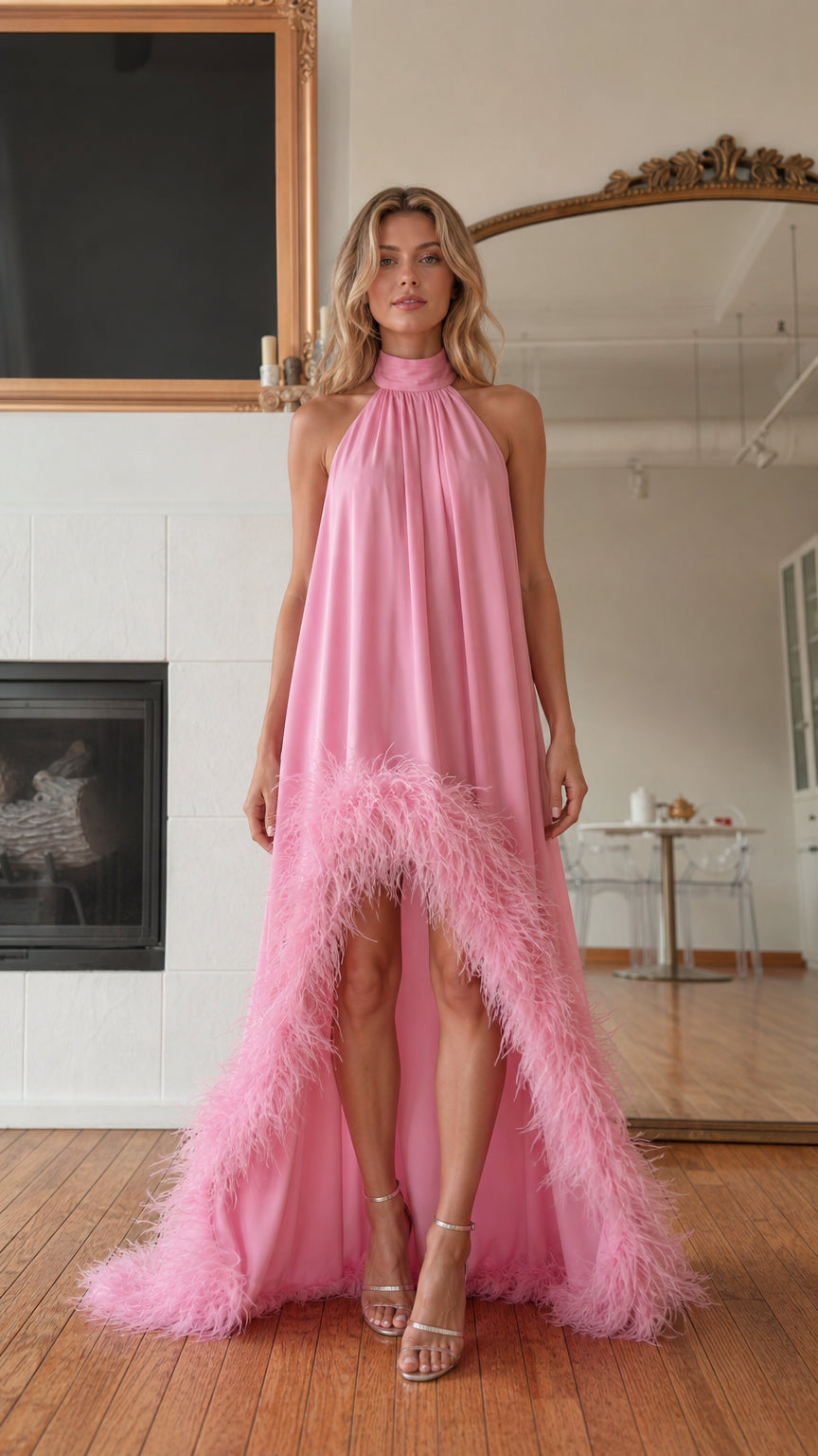 Front view of model wearing pink feather hem high neck maxi dress