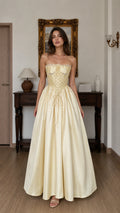 Front view of yellow corset ball gown maxi dress
