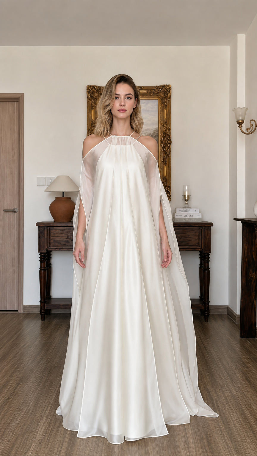 Front view of model wearing ivory halter neck flowy maxi dress