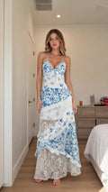 Front view of woman wearing blue floral lace cami maxi dress