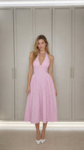 Front view of model wearing pink gingham halter midi dress