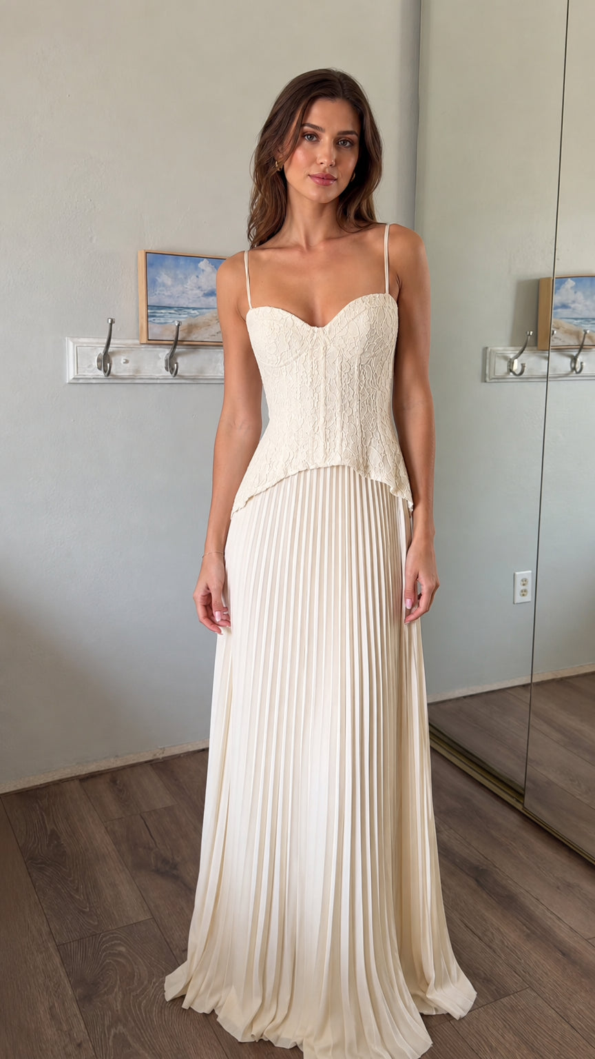 Front view of woman wearing white lace corset bodice pleated maxi dress