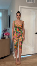 Front view of model wearing multi floral print jumpsuit