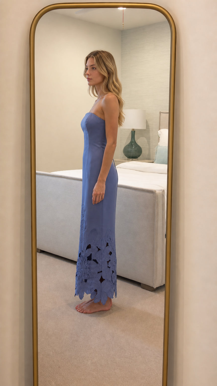 Side profile view of periwinkle strapless maxi dress