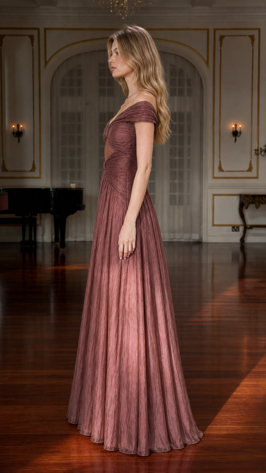 Side profile view of model in mauve pleated maxi gown