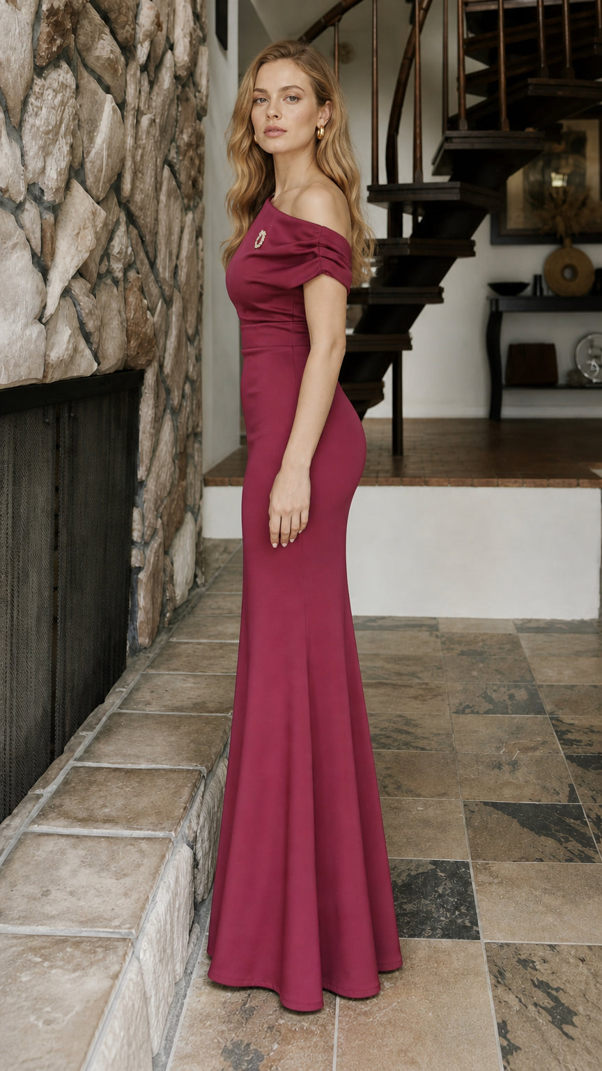 Side profile view of burgundy formal evening gown