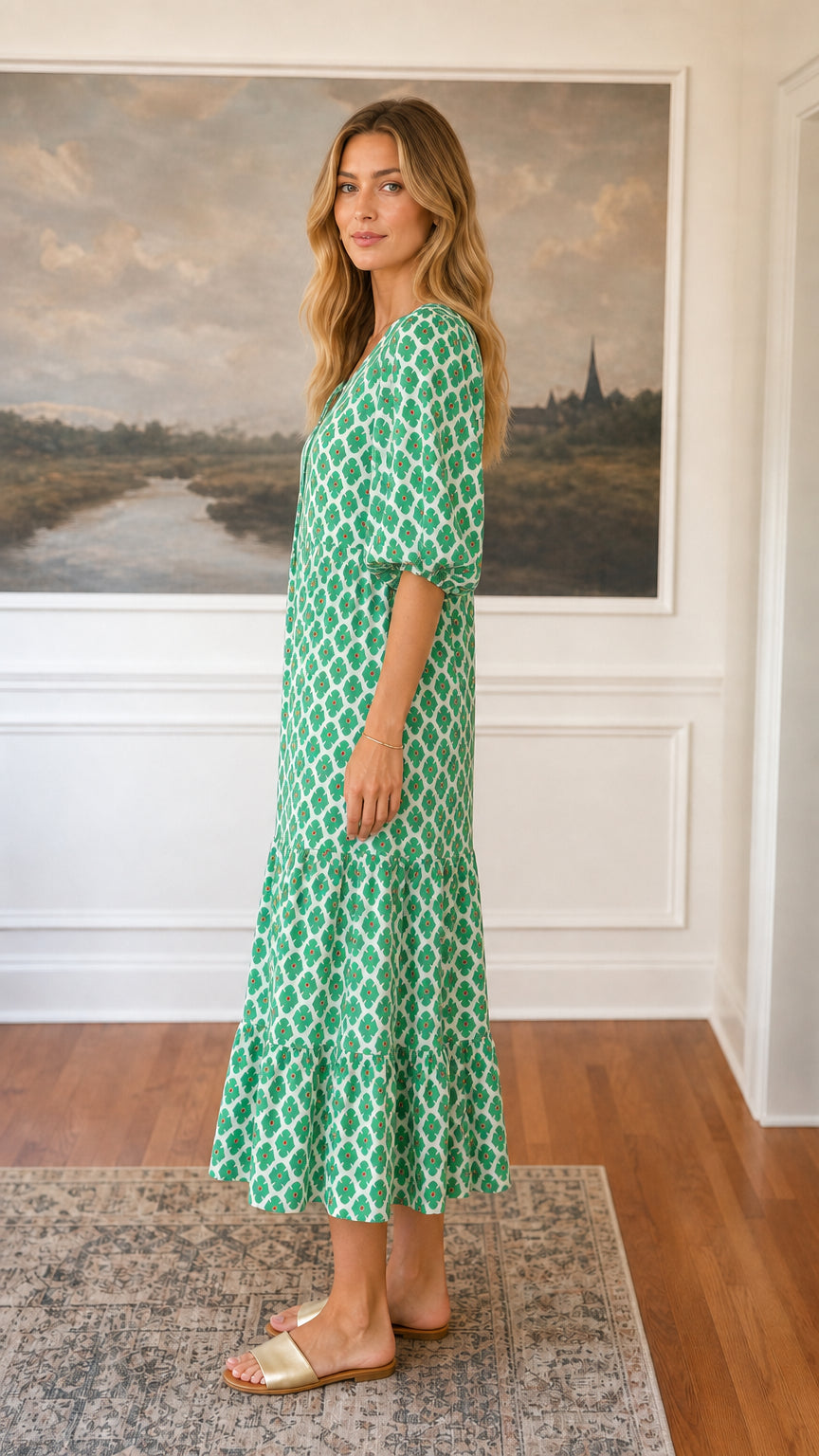 Side view of green floral tiered midi dress