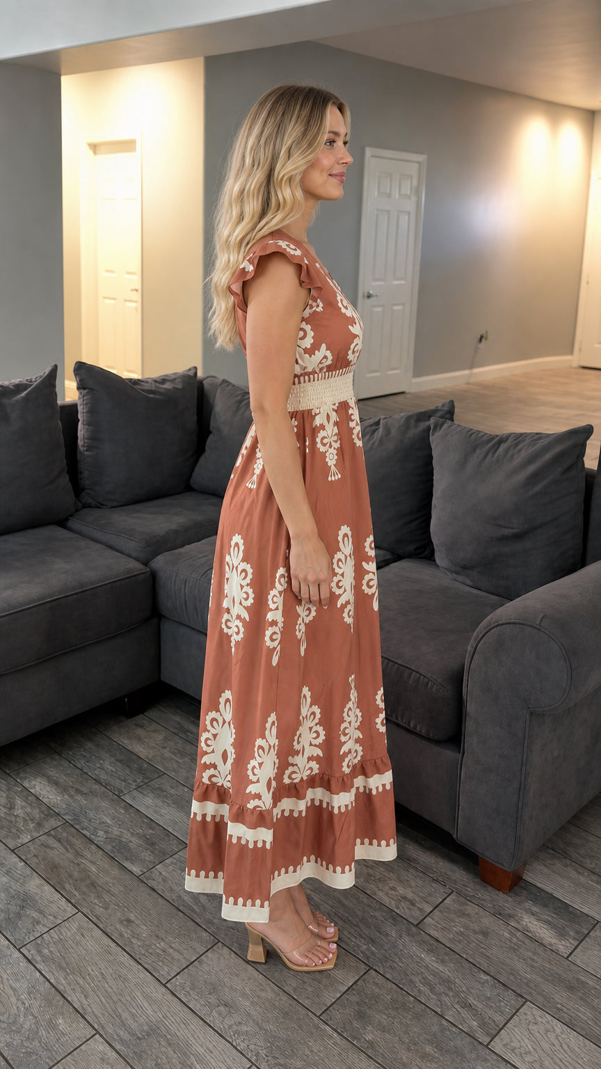 Side profile view of rust boho maxi dress