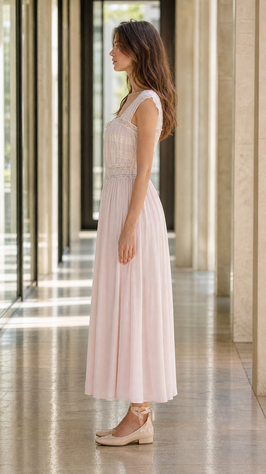Side profile of model in pink midi dress