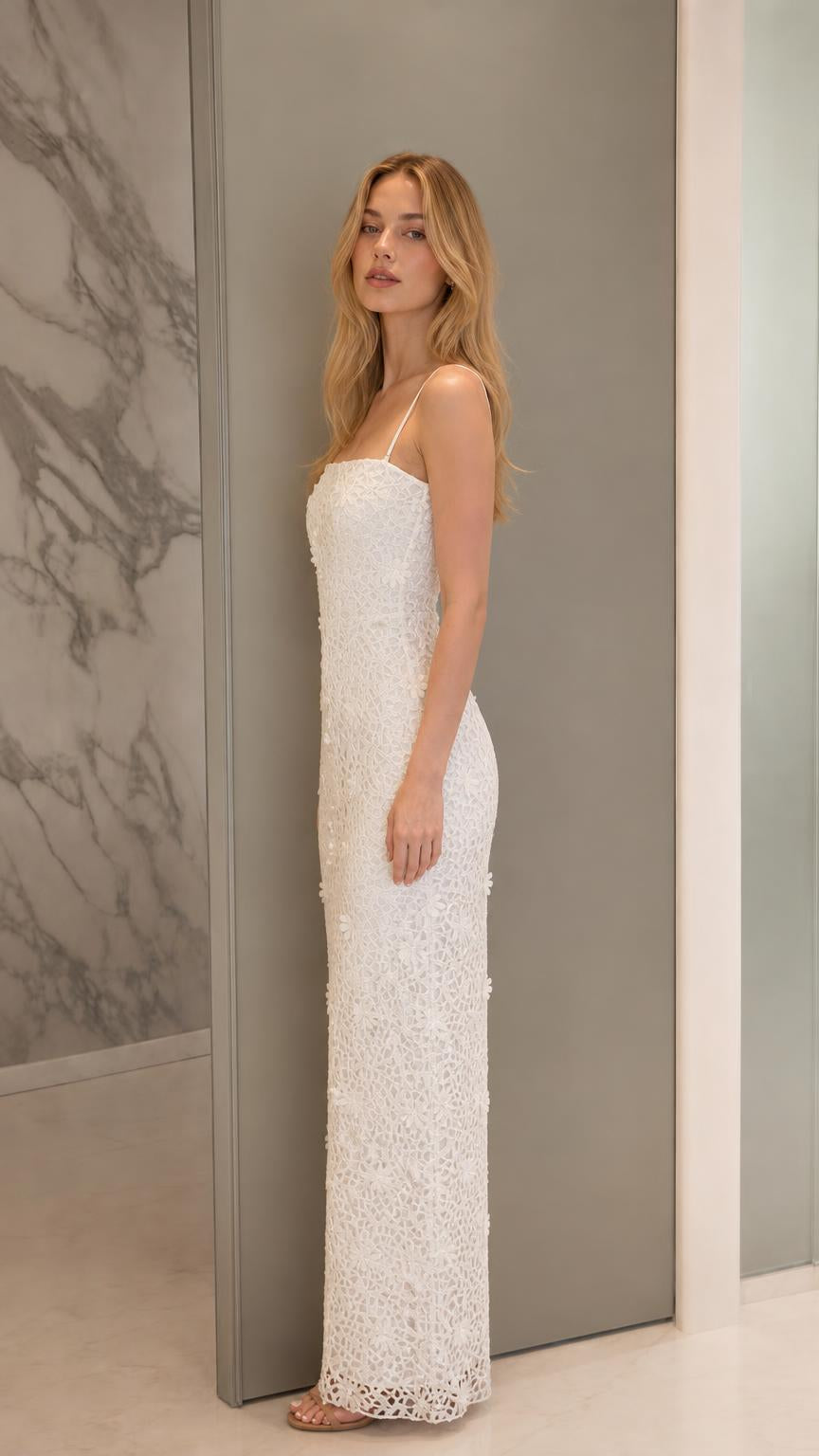 Side profile of model in white lace evening dress