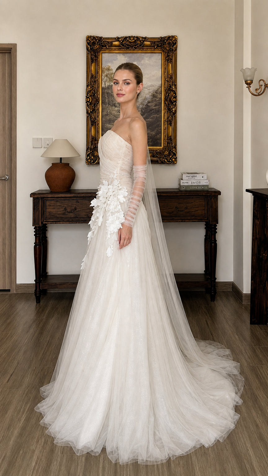 Side profile view of white tulle evening gown with sheer gloves
