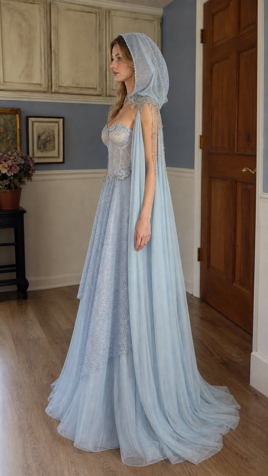 Side profile view of light blue hooded ball gown