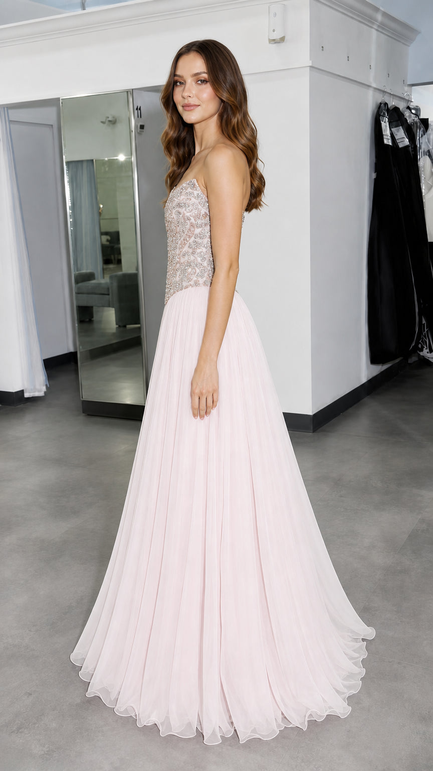 Side profile of model in pink evening gown