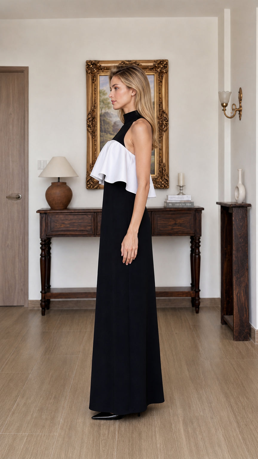 Side profile view of black and white ruffle maxi dress