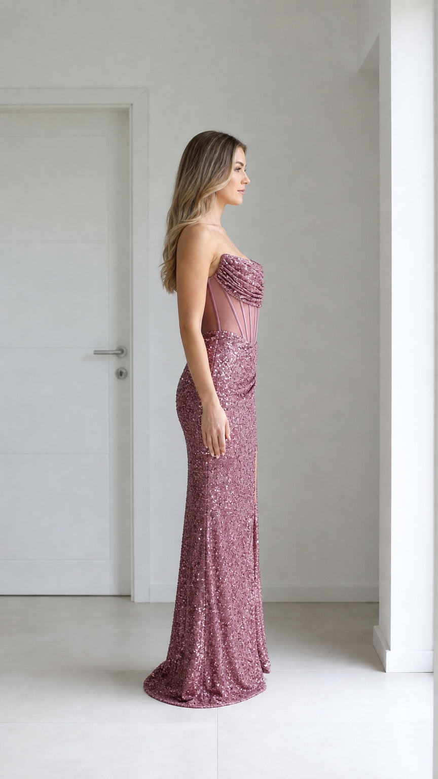 Side profile view of mauve sequin evening gown