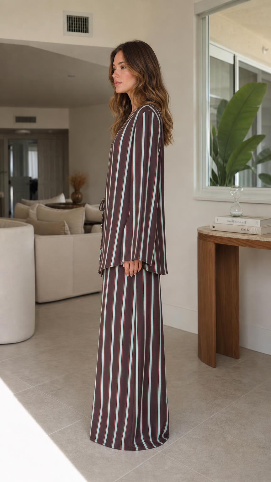 Model wearing brown striped two-piece set side view