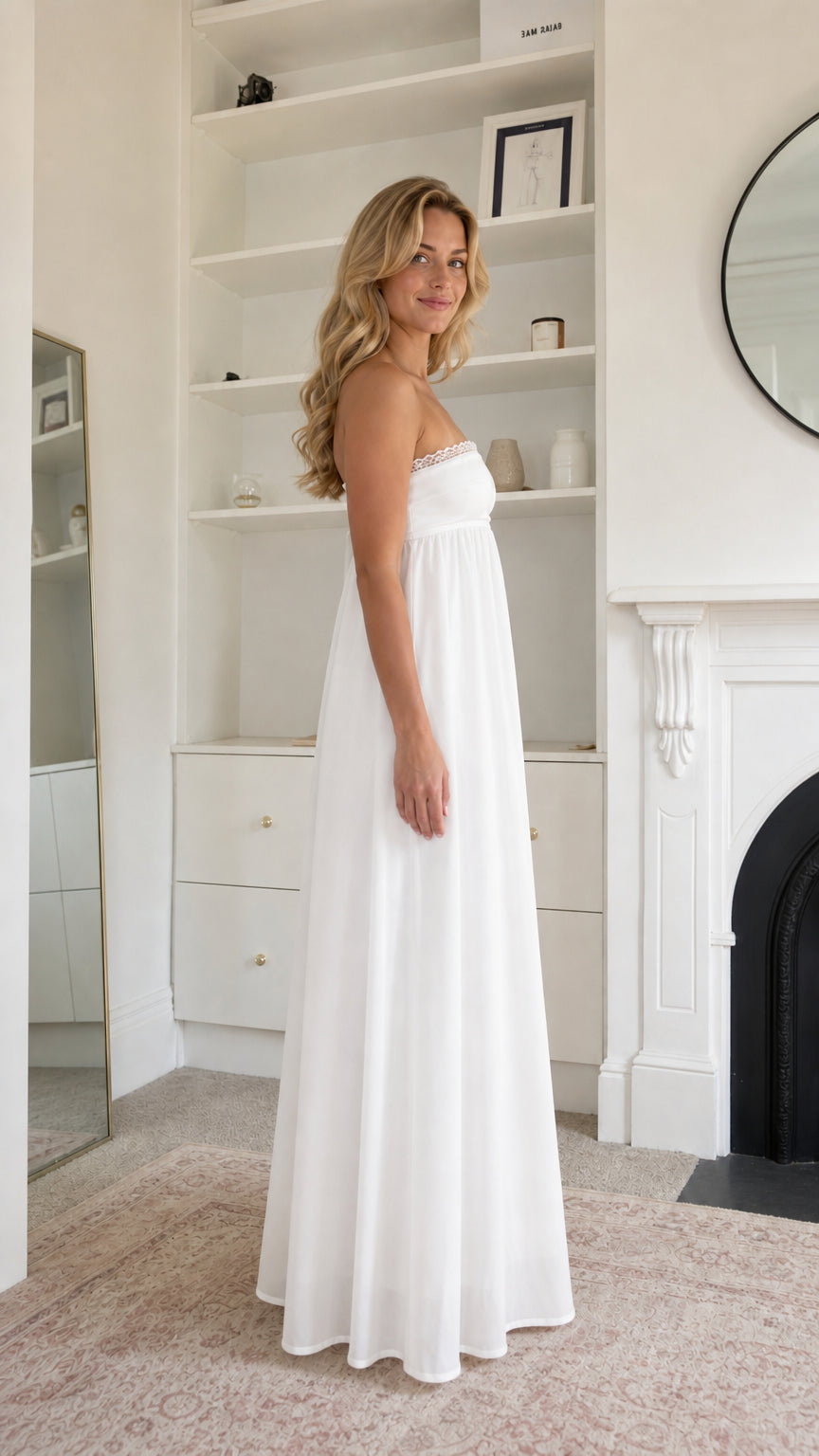 Side profile view of woman wearing white maxi dress
