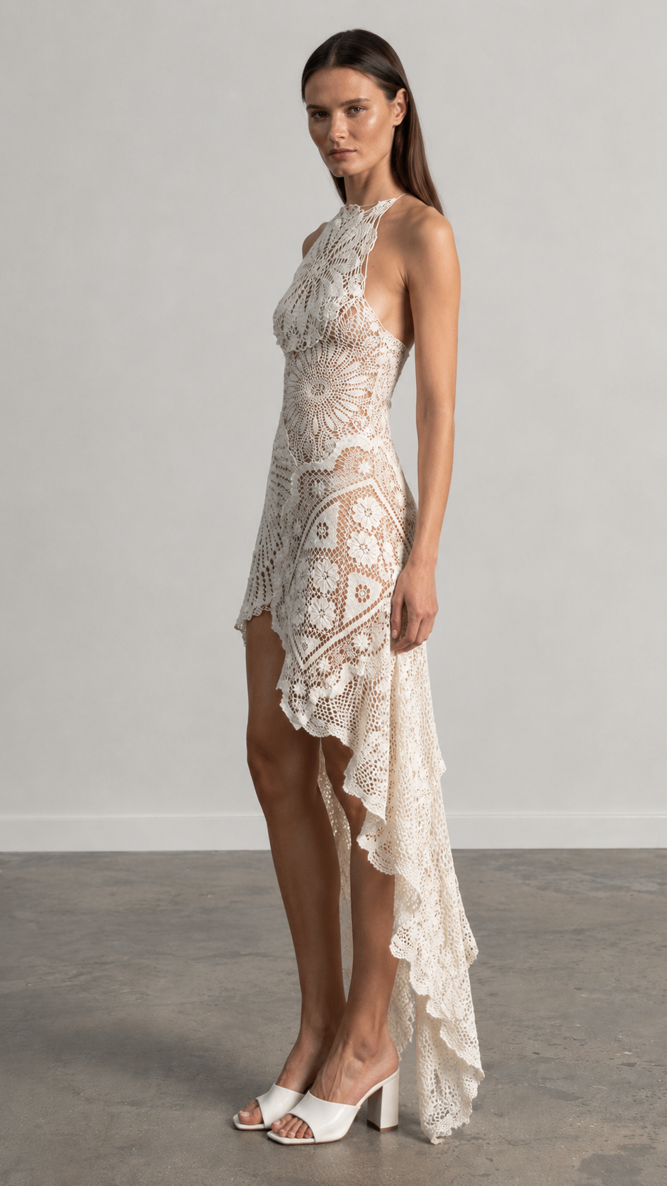 Side view of ivory lace halter-style high-low occasion dress