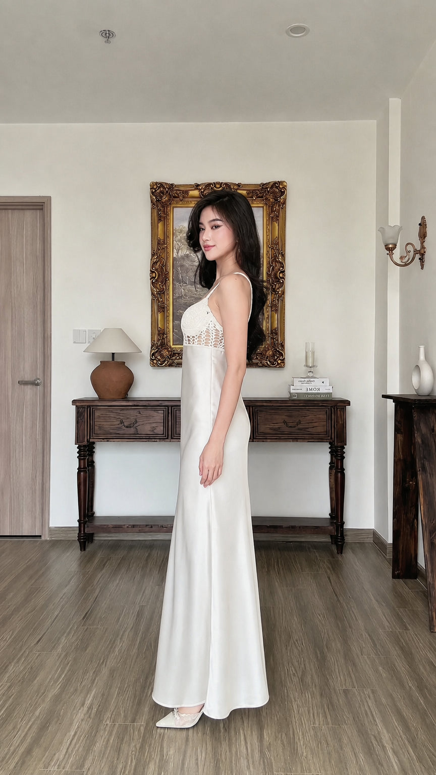 Side profile view of white satin slip dress