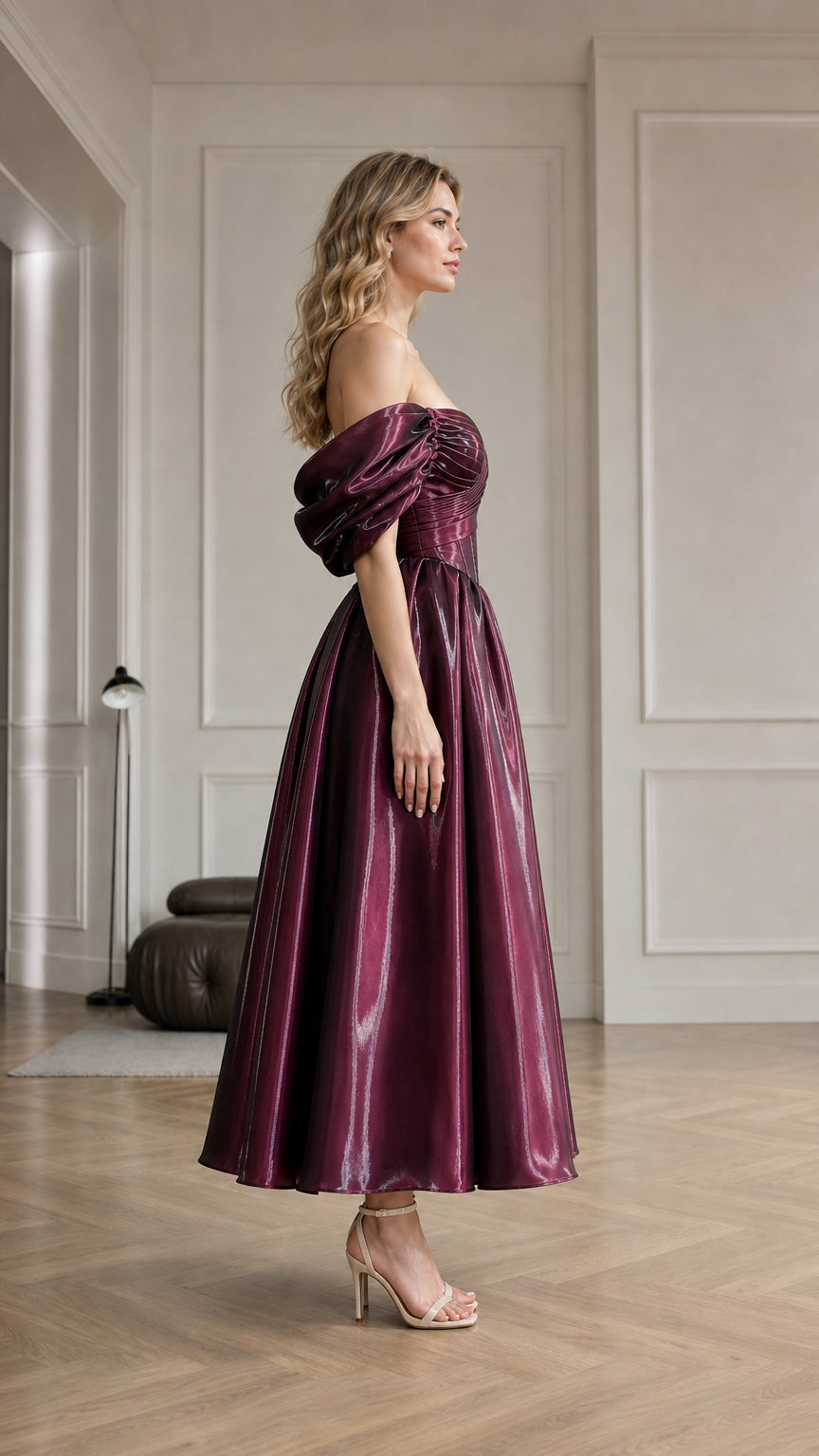 Side profile view of burgundy evening dress