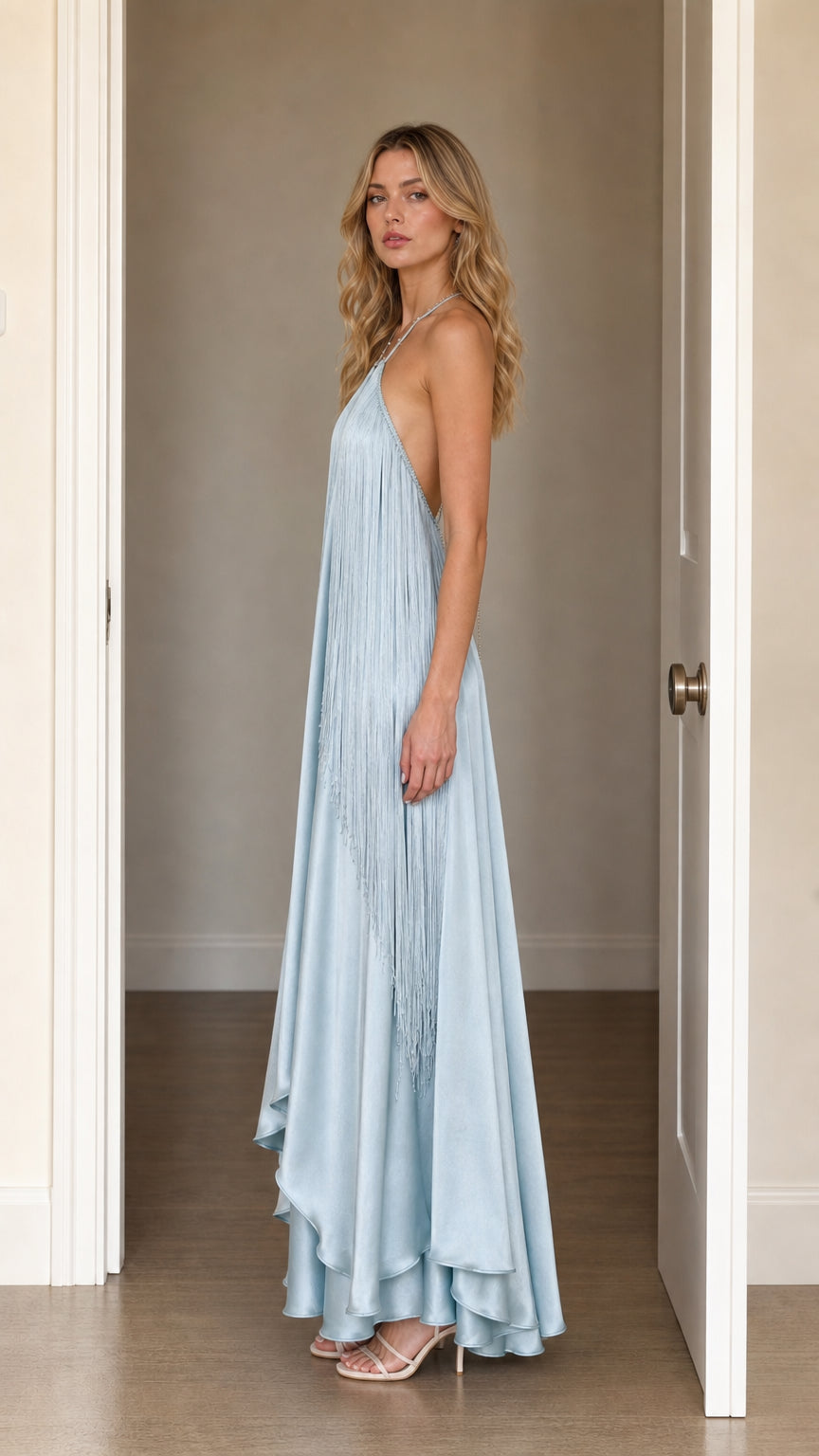 Side profile view of Light Blue halter fringe maxi dress