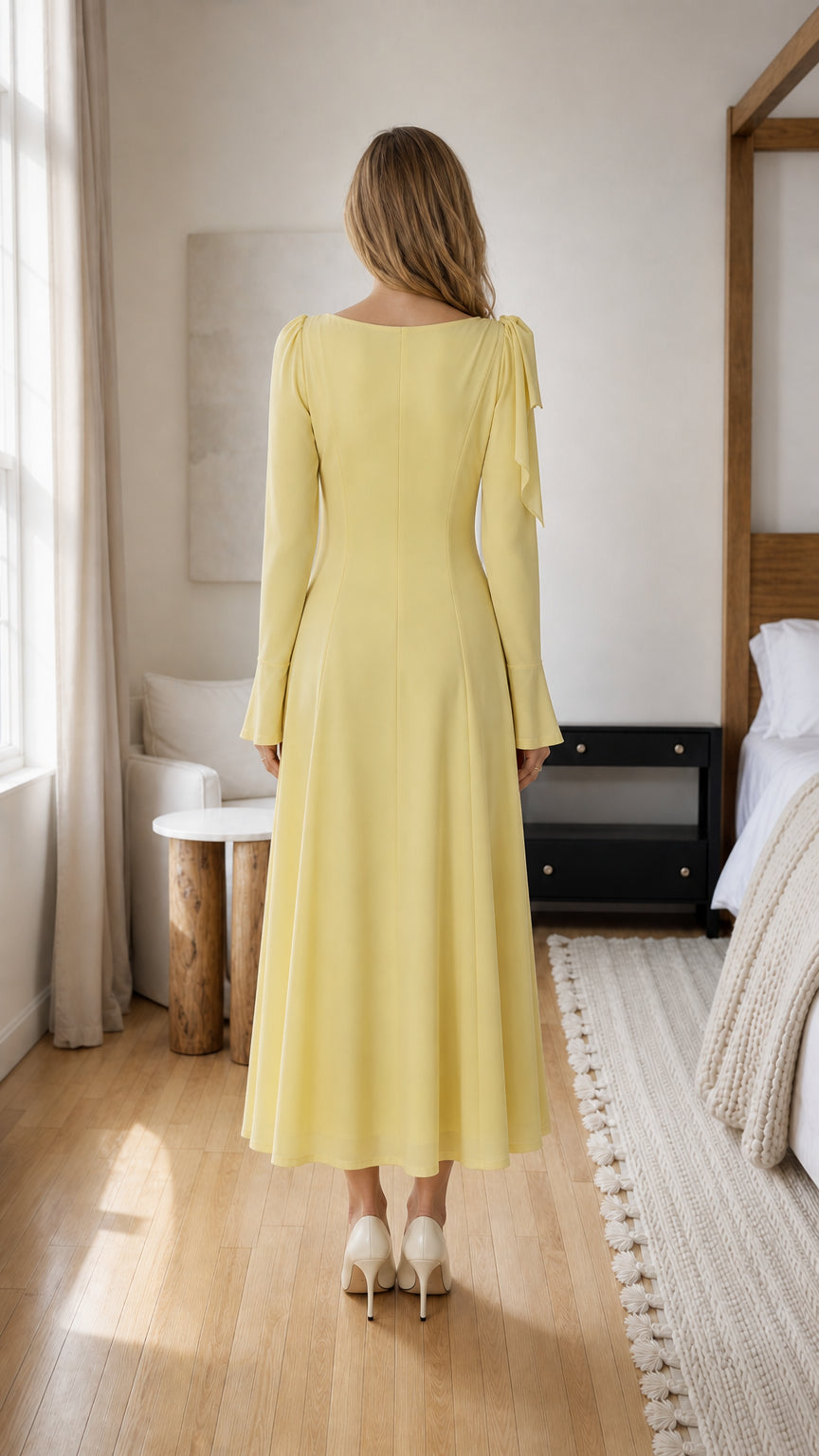 Back view of model in yellow midi dress