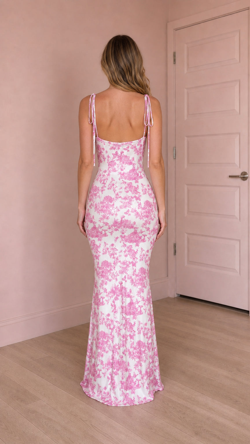 Back view of pink floral maxi dress showing tie straps