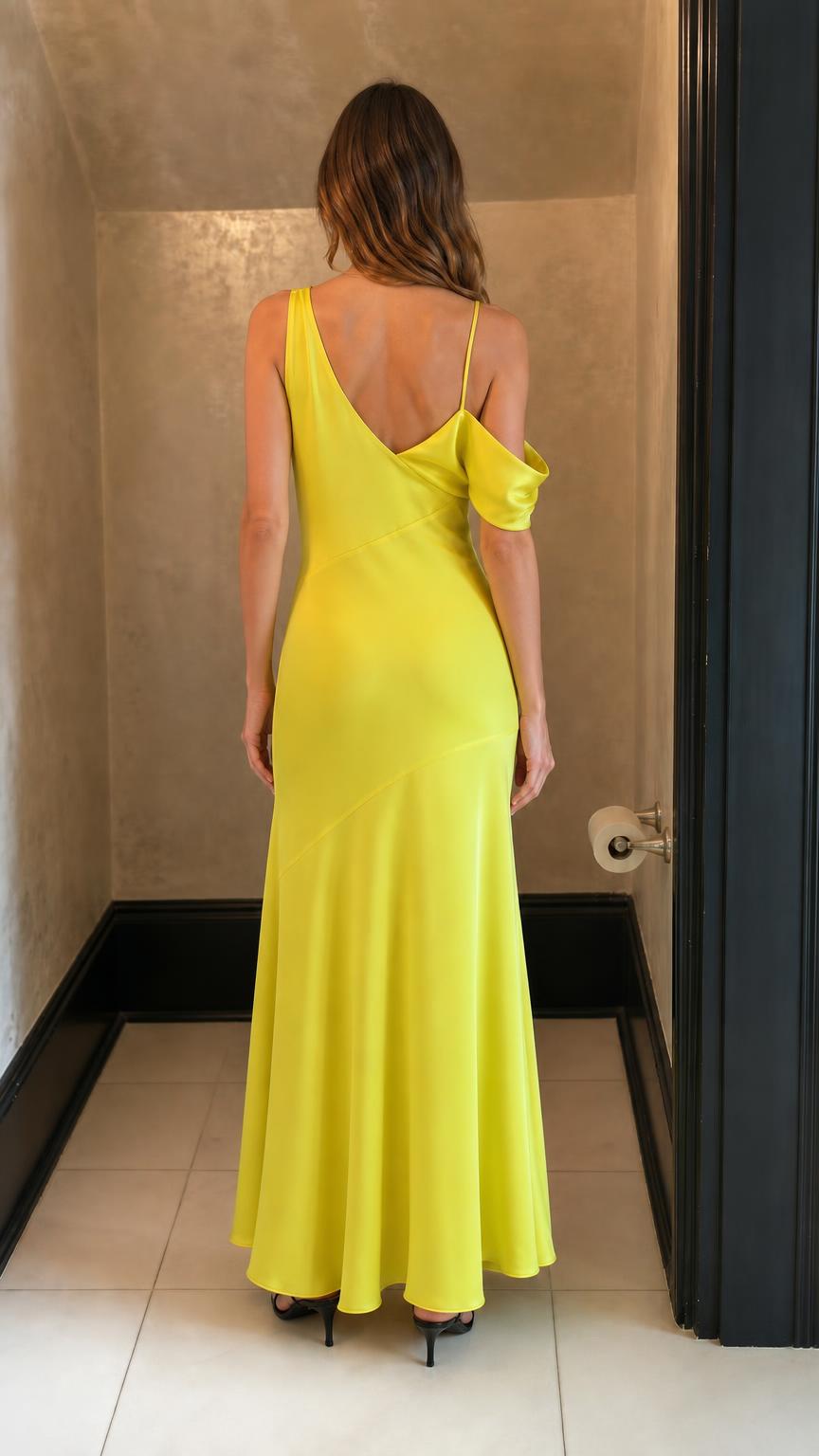Back view of woman wearing yellow satin maxi dress