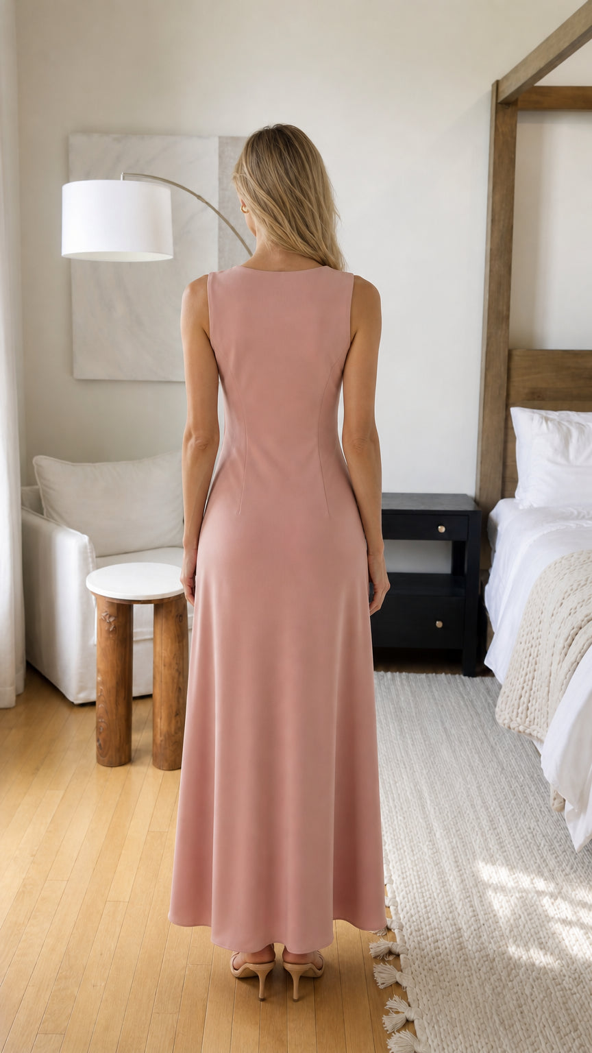 Back view of woman wearing pink maxi dress