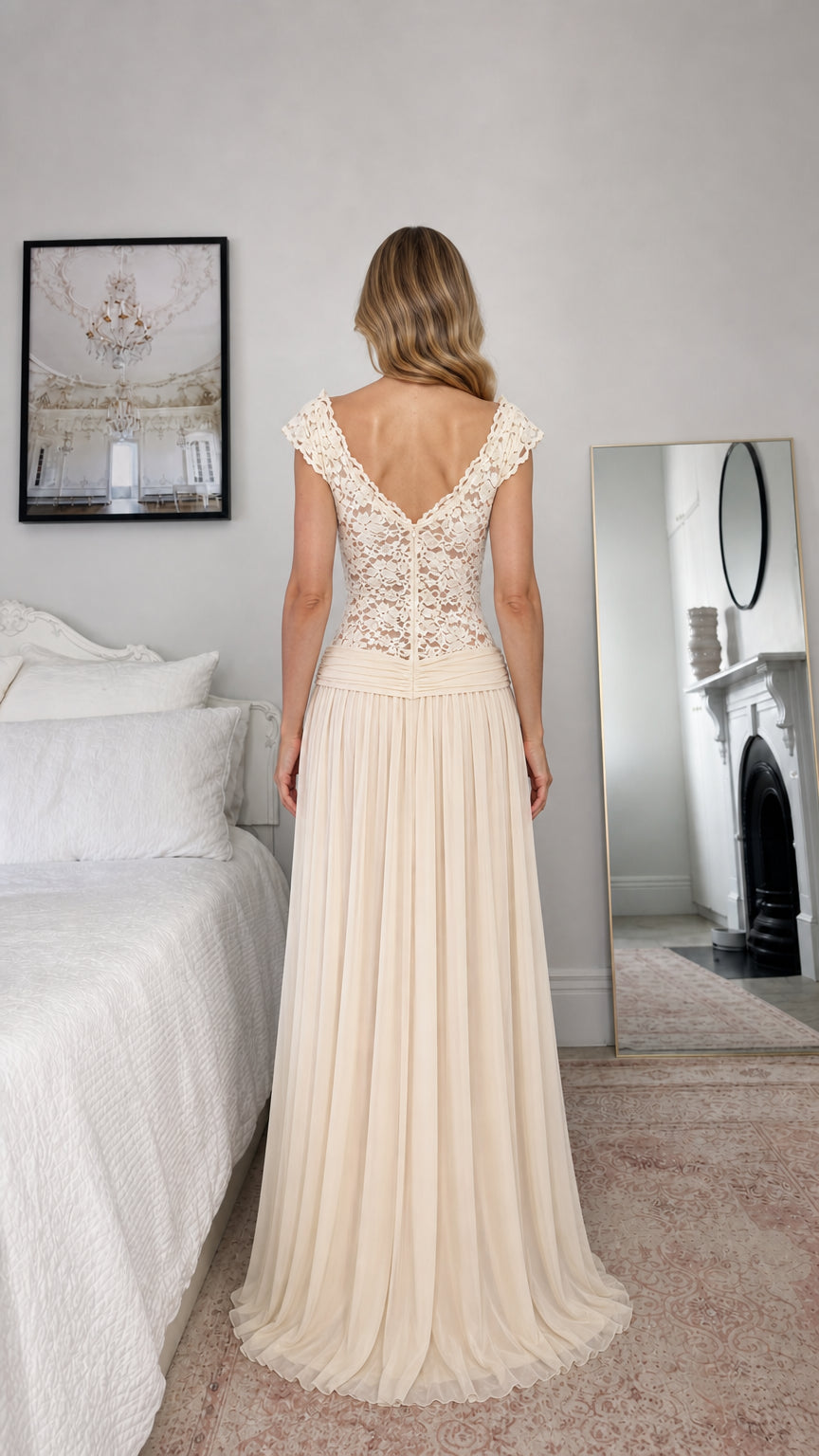 Back view of model wearing champagne formal dress