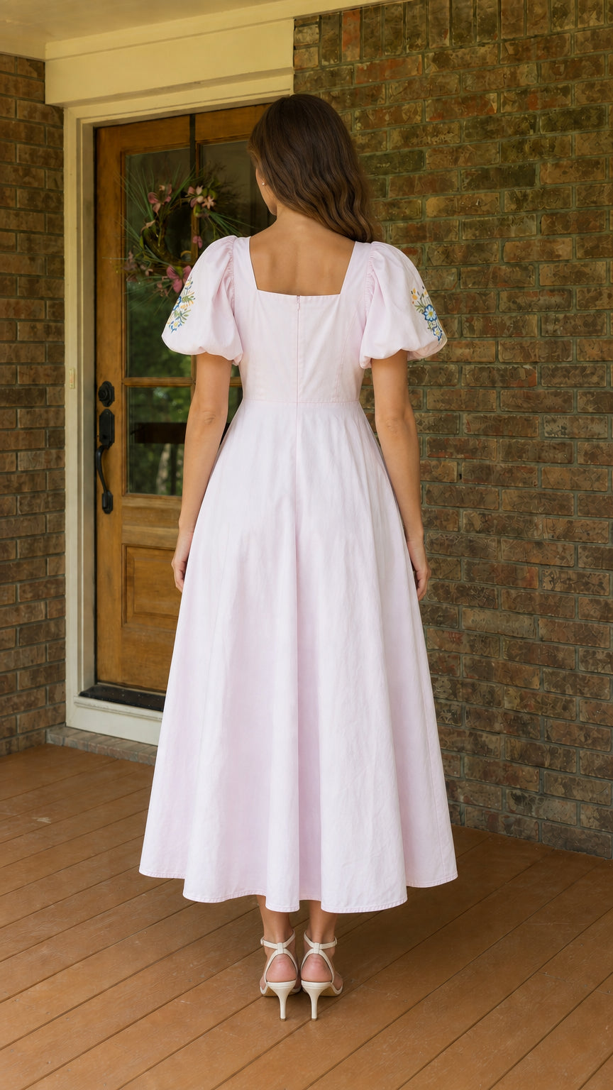 Back view of woman wearing pink square neck midi dress