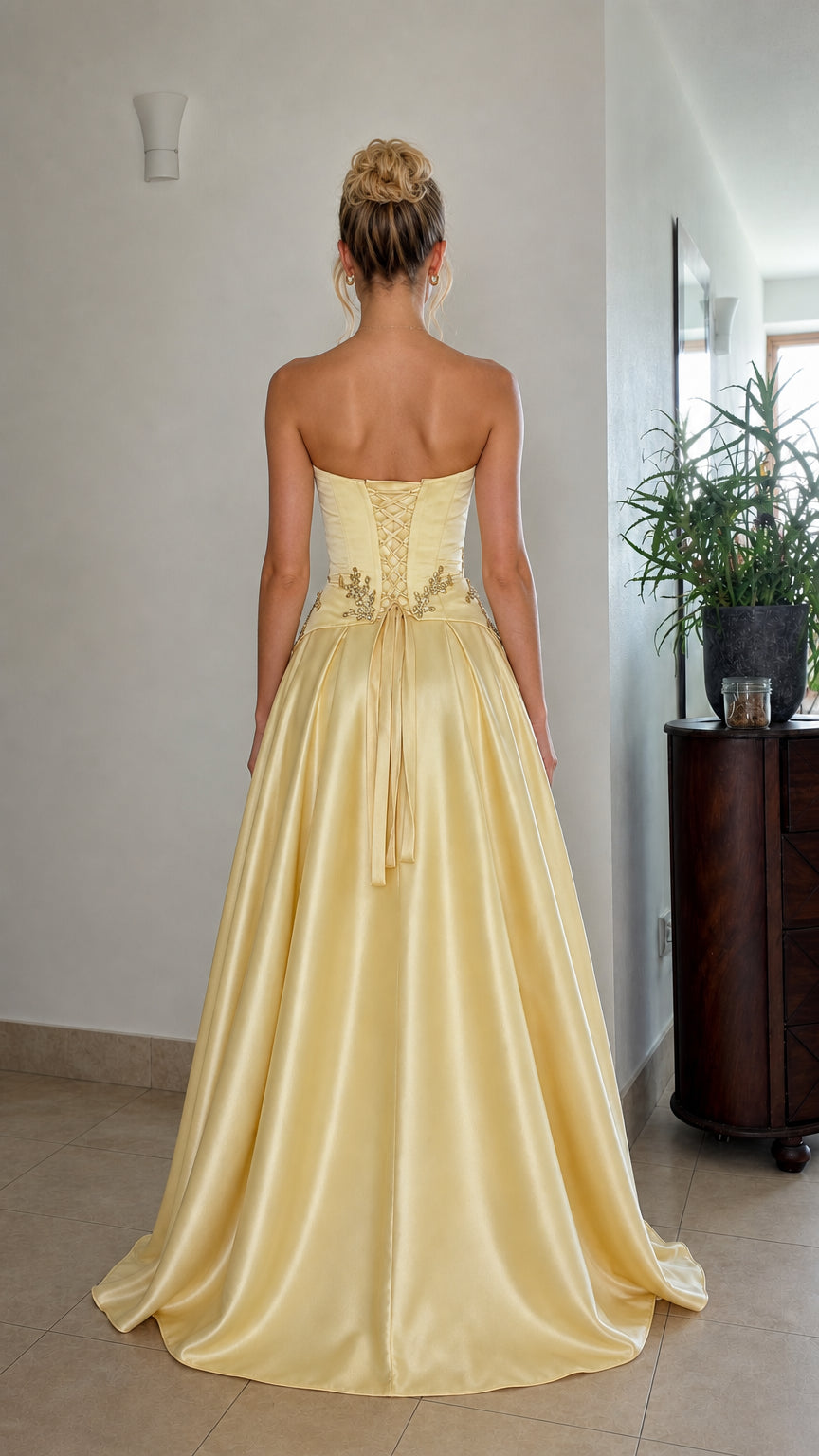 Back view of yellow satin evening dress with lace-up corset