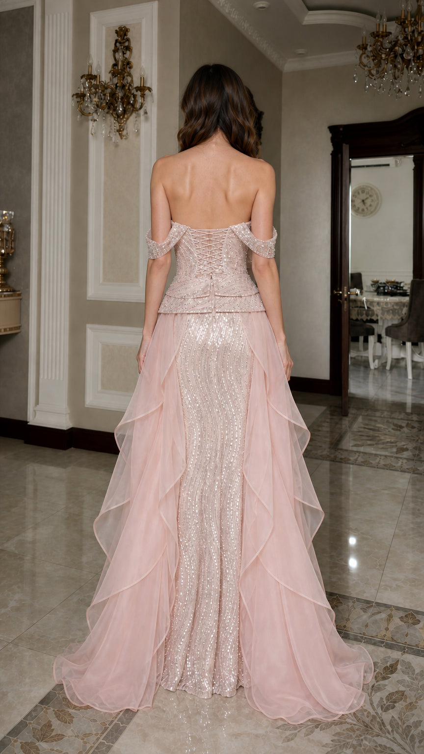 Back view of pink formal gown showing corset-style detailing